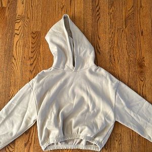 Large nude/cream Zara cropped sweatshirt that is chinched.